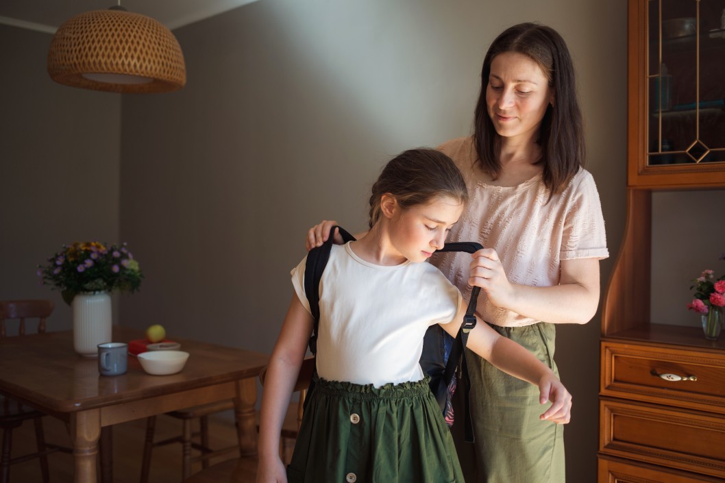 morning kitchen and dining room breakfast mom helps her daughter get ready for school she puts her t20 kLAnl4